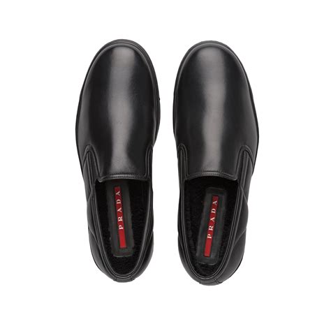 prada black slip ons